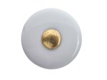 Baldų rankenėlė porcel. HETTICH, dengta žalvariu baltos sp. D32mm, 7175